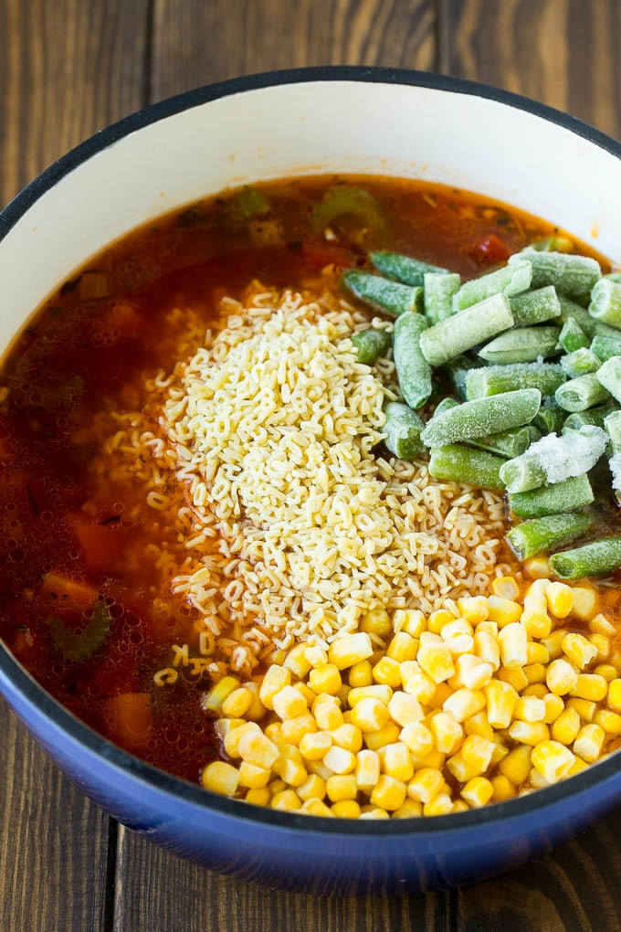Alphabet Soup Recipe | Hamburger Soup | Beef and Vegetable Soup #soup #hamburger #noodles #dinner #bajap #carrots A pot with noodles, broth, frozen corn and frozen green beans.