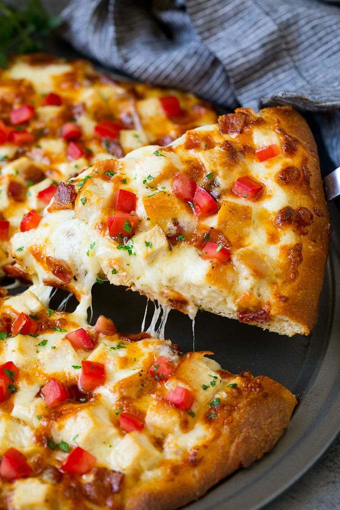 Chicken Alfredo Pizza Recipe #pizza #chicken #bacon #dinner #bajap A slice of chicken Alfredo pizza with bacon and fresh tomatoes.