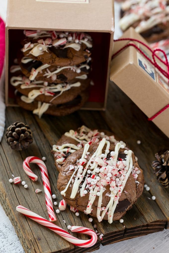 Peppermint Bark Cookie | Easy Peppermint Bark Cookies | Christmas Cookies | Peppermint Bark Cookies | Chocolate Peppermint Cookie #peppermint #peppermintbark #cookies #christmas #holiday #dessert #bajap Chocolate Peppermint Cookies topped with crushed candy canes in a gift box.