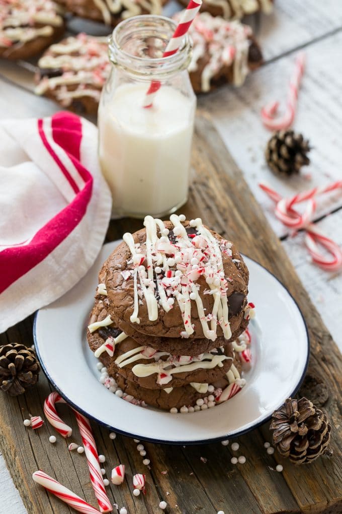 Peppermint Bark Cookie | Easy Peppermint Bark Cookies | Christmas Cookies | Peppermint Bark Cookies | Chocolate Peppermint Cookie #peppermint #peppermintbark #cookies #christmas #holiday #dessert #bajap A plate of chocolate peppermint bark cookies with a bottle of milk on the side.