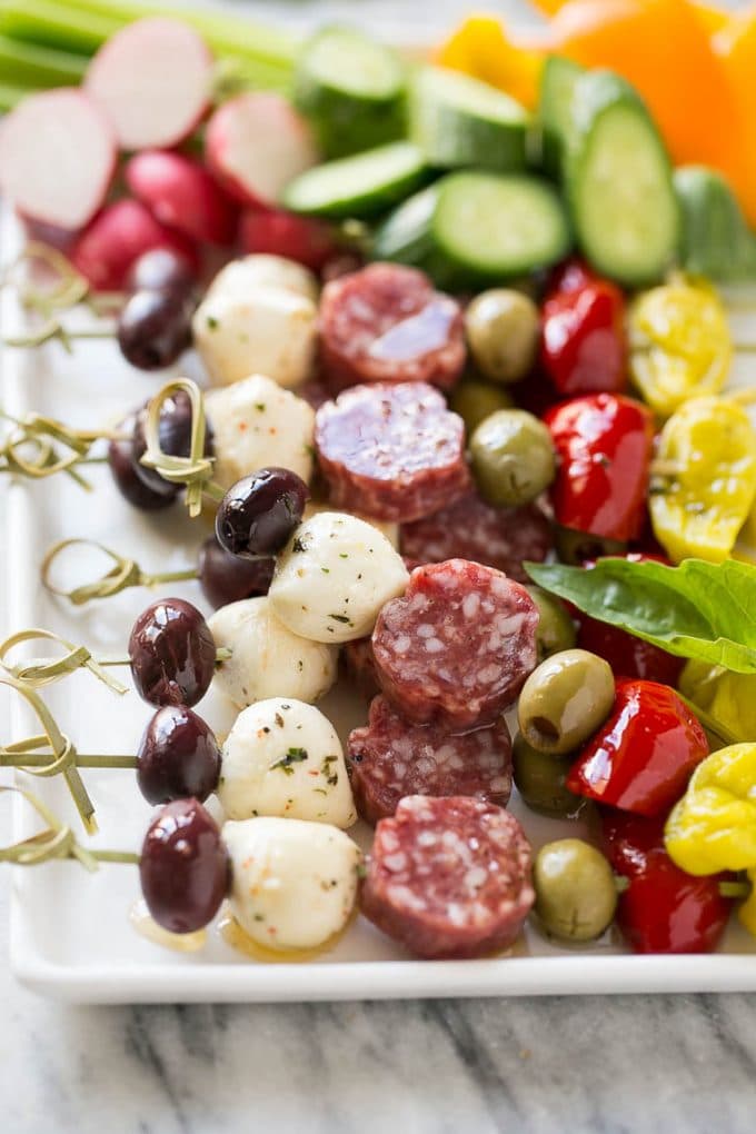 Antipasto Skewers Recipe | Easy Antipasto | Best Antipasto #antipasto #skewers #appetizer #bajap Antipasto skewers on a white serving platter.