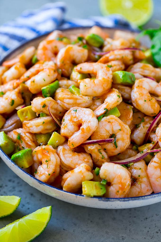 Mexican Shrimp Cocktail Recipe | Coctel de Camarones | Shrimp Cocktail | Mexican Shrimp #shrimp #appetizer #avocado #mexican #bajap A serving bowl of Mexican shrimp cocktail which contains small shrimp, diced avocado, herbs and jalapeno.