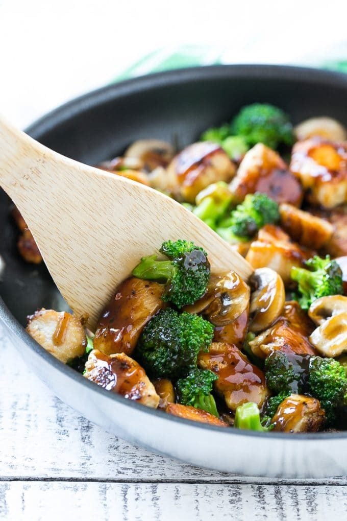 Chicken and Broccoli Stir Fry Recipe | Chicken Stir Fry | Healthy Chicken Recipe | Chicken and Broccoli | Chinese Food #chicken #broccoli #stirfry #healthy #cleaneating #dinner #bajap A spatula scooping chicken stir fry out of a pan.
