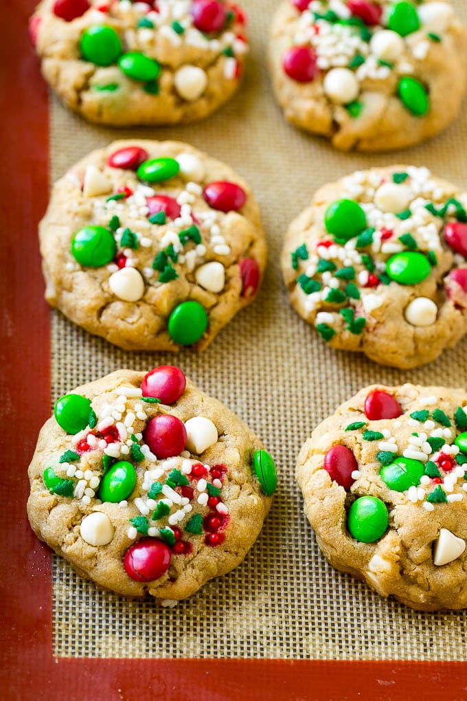Christmas Monster Cookies Recipe | Oatmeal Cookies | Peanut Butter Cookies | M&M's Cookies #baking #cookies #dessert #peanutbutter #chocolate #bajap #christmas #sprinkles Baked Christmas cookies on a sheet pan.