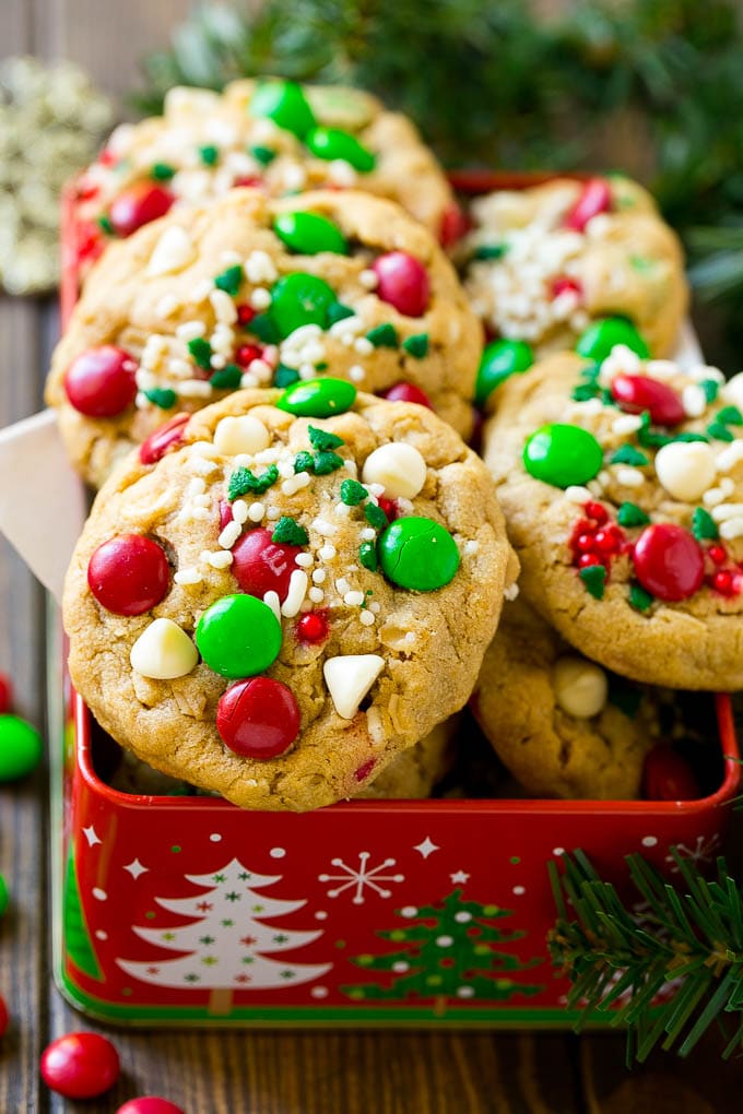 Christmas Monster Cookies Recipe | Oatmeal Cookies | Peanut Butter Cookies | M&M's Cookies #baking #cookies #dessert #peanutbutter #chocolate #bajap #christmas #sprinkles Christmas monster cookies in a gift tin.