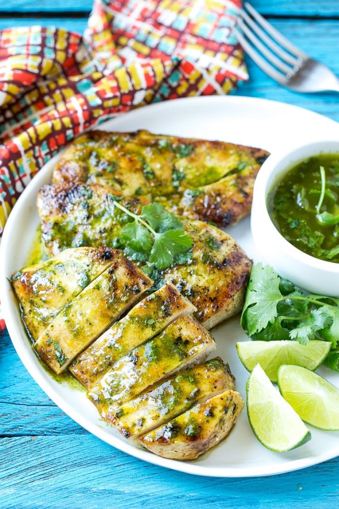 Cilantro Lime Chicken | Grilled Chicken #chicken #grilling #cilantro #lime #dinner #bajap Sliced cilantro lime chicken on a serving plate.