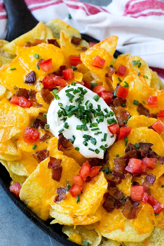 Irish Nachos Recipe | Potato Nachos | Potato Chip Recipe | Appetizer Recipe #nachos #potatoes #cheese #bacon #appetizer #bajap A skillet of Irish nachos topped with melted cheese, bacon, tomatoes and sour cream.