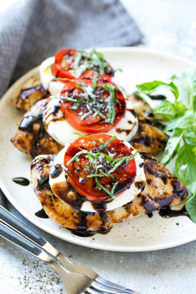 Chicken Caprese Recipe | Grilled Chicken #chicken #caprese #grilling #dinner #tomato #basil #bajap Grilled chicken breasts topped with mozzarella cheese, tomatoes and basil.