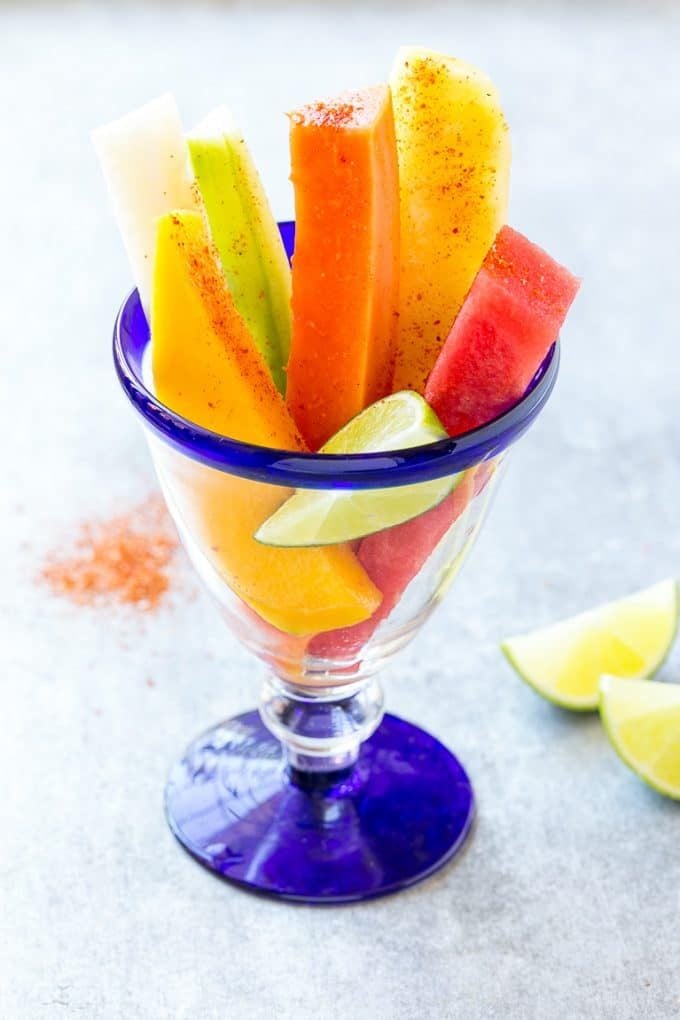 Mexican Fruit Cups | Fruit Cups | Mexican Fruit | Tropical Fruit #fruit #fruitcup #watermelon #pineapple #snack #healthy #bajap Mexican fruit cups topped with chili lime seasoning.