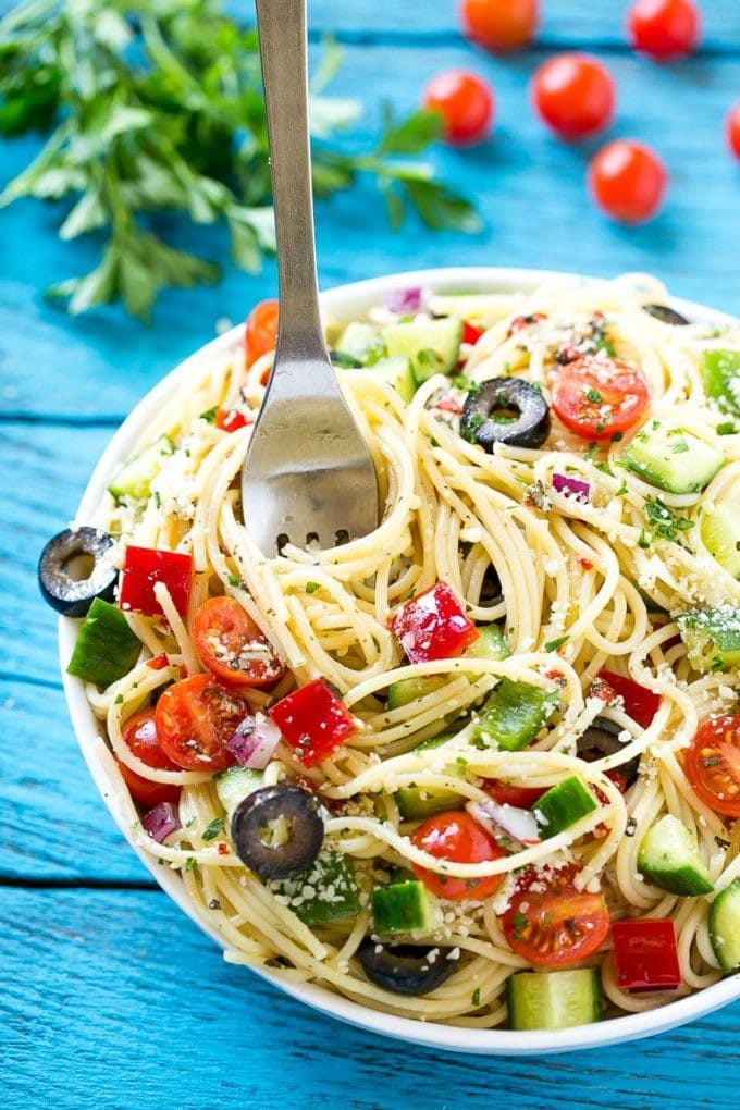 Spaghetti Salad Recipe | Pasta Salad | Potluck Recipe | Easy Pasta Salad #spaghetti #pasta #salad #bajap A bowl of spaghetti salad with a serving fork in it.
