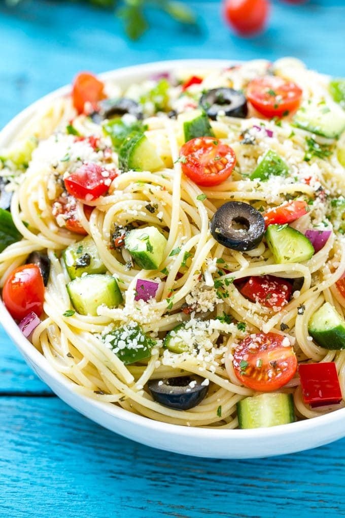 Spaghetti Salad Recipe | Pasta Salad | Potluck Recipe | Easy Pasta Salad #spaghetti #pasta #salad #bajap A bowl of pasta salad with cucumbers, olives and parmesan cheese.