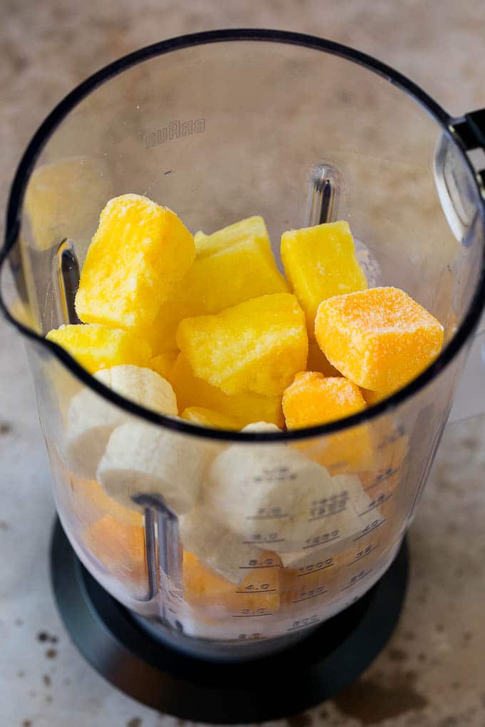 Tropical Smoothie Recipe | Mango Smoothie | Pineapple Smoothie #smoothie #mango #pineapple #banana #drink #bajap Pineapple, mango, banana and coconut milk in a blender.