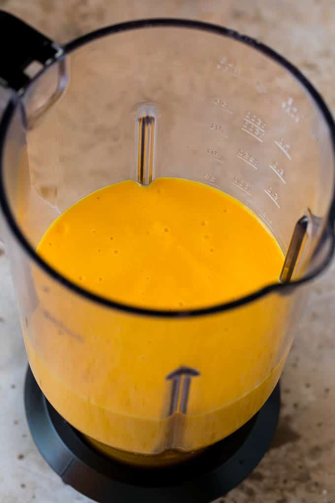 Tropical Smoothie Recipe | Mango Smoothie | Pineapple Smoothie #smoothie #mango #pineapple #banana #drink #bajap A smoothie inside of a blender.