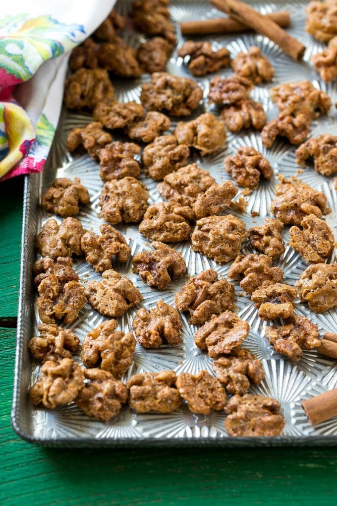 Candied Walnuts Recipe | Candied Nuts | Glazed Walnuts | Cinnamon Sugar Walnuts #walnuts #dessert #snack #bajap A sheet pan with a layer of glazed walnut halves.
