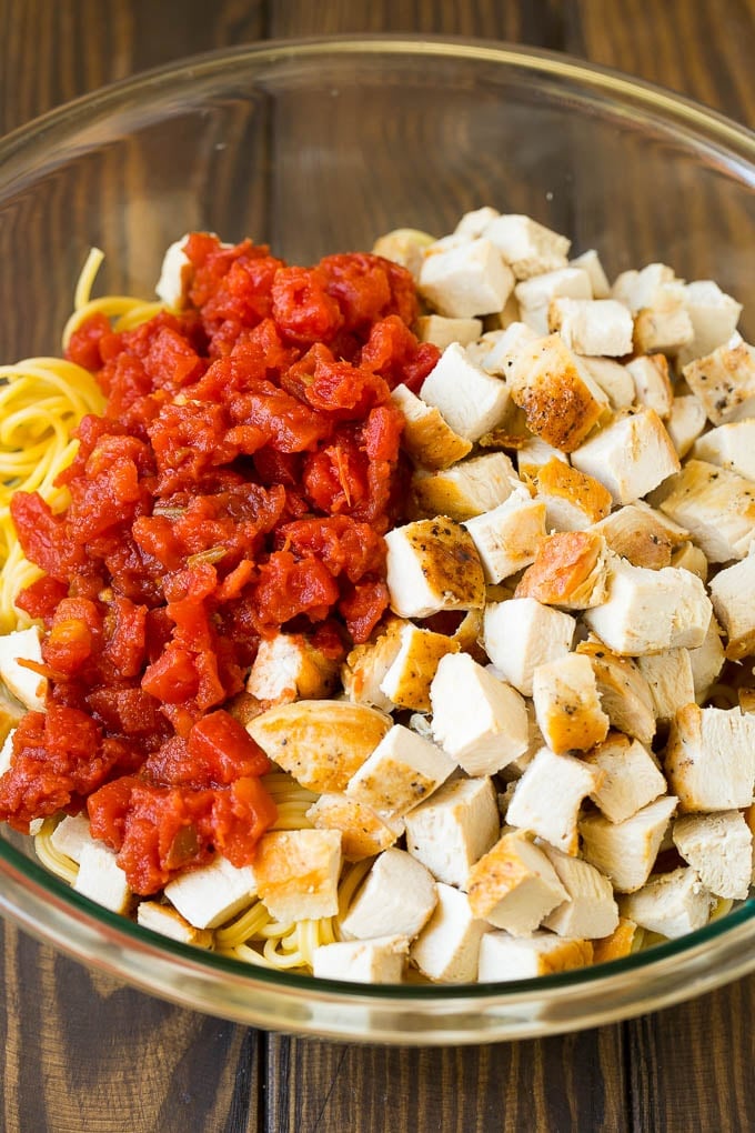 Chicken Spaghetti Recipe | Baked Spaghetti #pasta #spaghetti #chicken #cheese #casserole #dinner #bajap Diced chicken, tomatoes and spaghetti in a bowl.