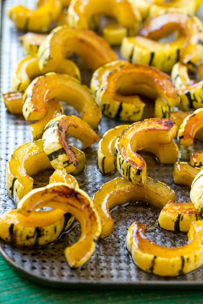 Brown Sugar Delicata Squash Recipe | Roasted Squash | Delicata Squash | Winter Squash Recipe #squash #wintersquash #brownsugar #sidedish #delicatasquash #dinner #bajap A delicata squash recipe with brown sugar roasted squash on a sheet pan.