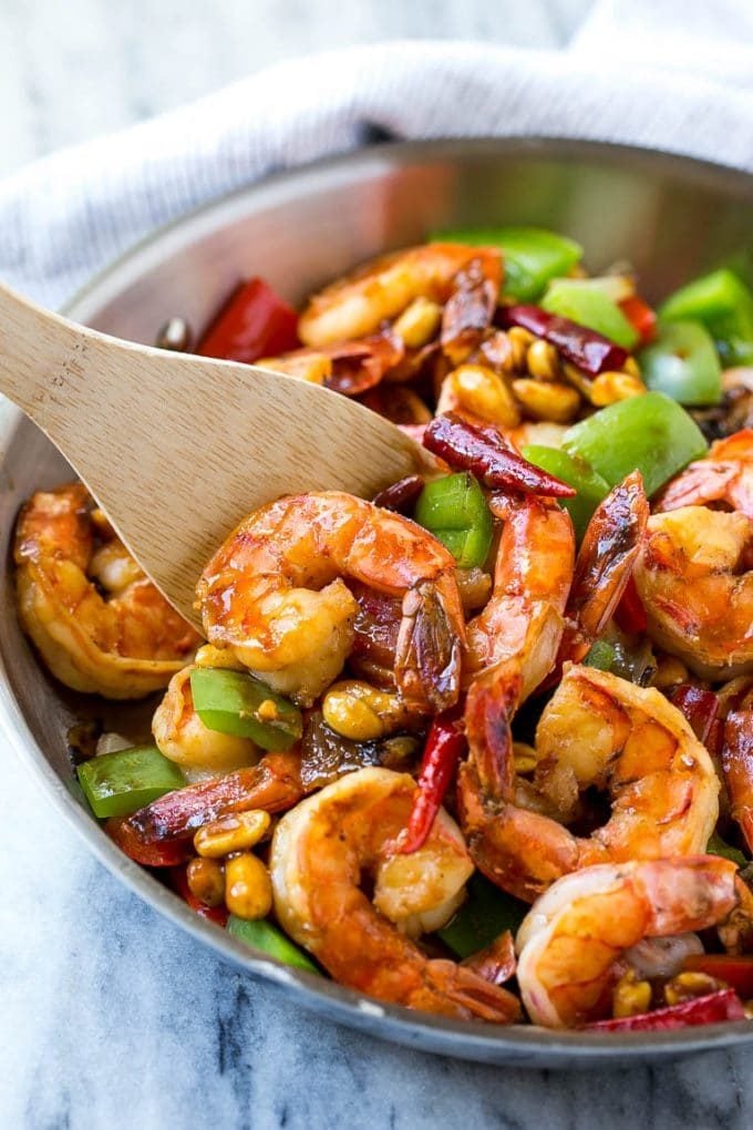 Kung Pao Shrimp | Shrimp Recipe | Shrimp Stir Fry | Easy Shrimp Recipe #shrimp #stirfry #peppers #dinner #bajap #spicy A serving spatula in a pan of Kung Pao shrimp.