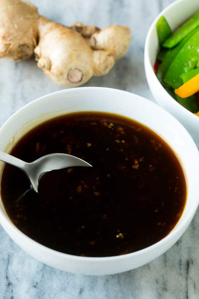 Teriyaki Shrimp Stir Fry Recipe | Shrimp Stir Fry | Healthy Stir Fry #shrimp #teriyaki #vegetables #stirfry #dinner #bajap A bowl of homemade teriyaki sauce with a spoon in it.