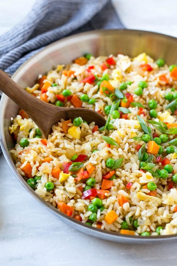 Veggie Fried Rice Recipe | Vegetarian Fried Rice | Easy Fried Rice Recipe | Chinese Food #rice #friedrice #veggie #vegetarian #sidedish #bajap Veggie fried rice in a skillet with a serving spoon.