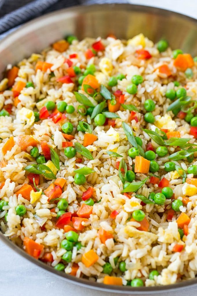 Veggie Fried Rice Recipe | Vegetarian Fried Rice | Easy Fried Rice Recipe | Chinese Food #rice #friedrice #veggie #vegetarian #sidedish #bajap A skillet of vegetarian fried rice with eggs, peas, carrots and peppers.