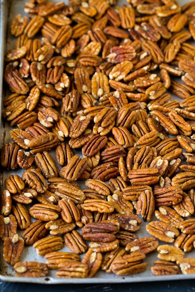 Candied Pecans Recipe | Glazed Pecans | Sugared Pecans #pecans #nuts #snack #dessert #bajap Pecan halves on a sheet pan.