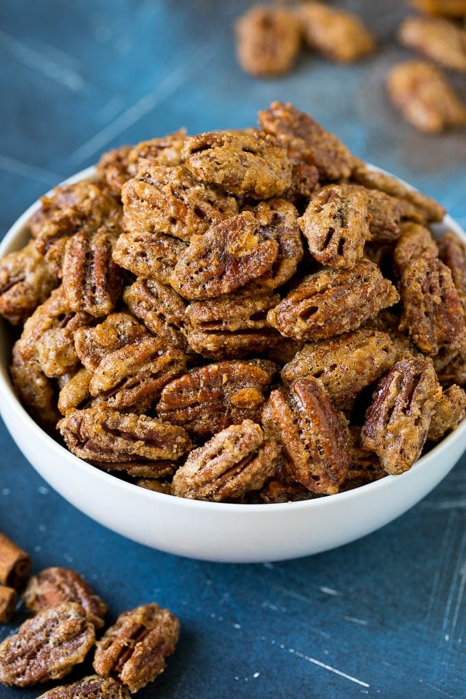 Candied Pecans Recipe | Glazed Pecans | Sugared Pecans #pecans #nuts #snack #dessert #bajap A bowl filled with homemade candied pecans.