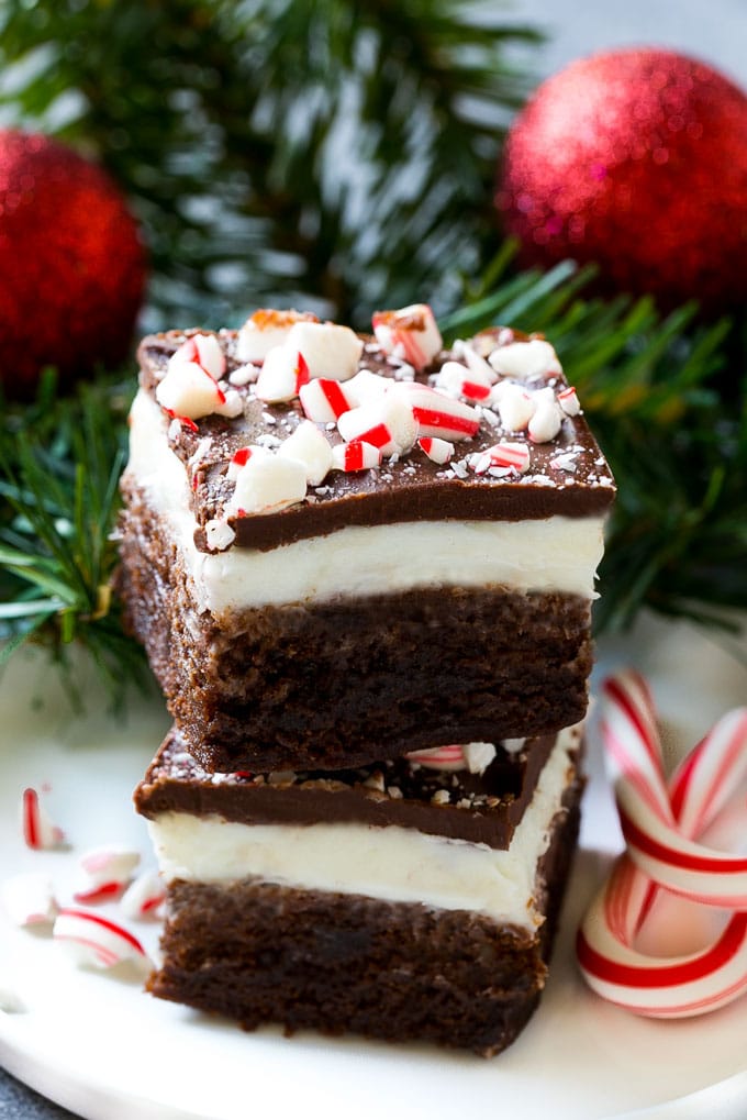 Peppermint Brownies Recipe | Holiday Brownies | Candy Cane Brownies | Mint Brownies #brownies #mint #peppermint #chocolate #dessert #christmas #bajap These layered treats on a plate are simple to make yet look so impressive.