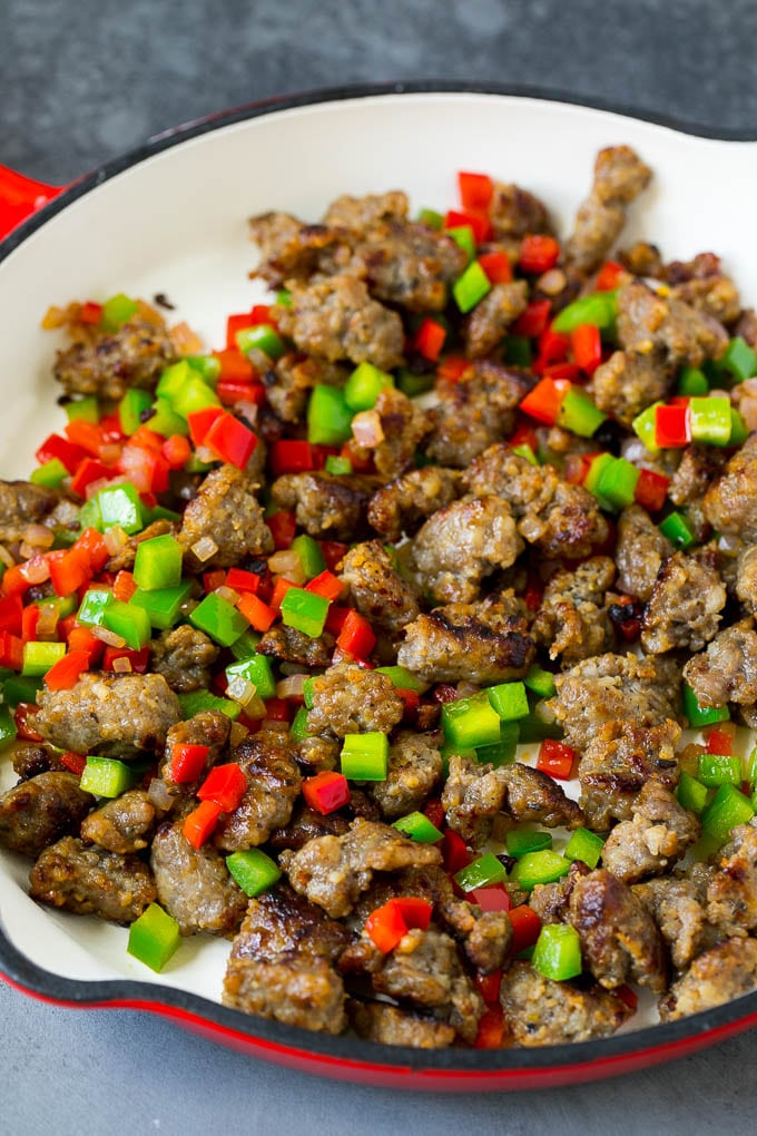 Sweet Potato Hash #sweetpotato #sausage #breakfast #brunch #bajap Sausage, onions and bell peppers in a skillet.