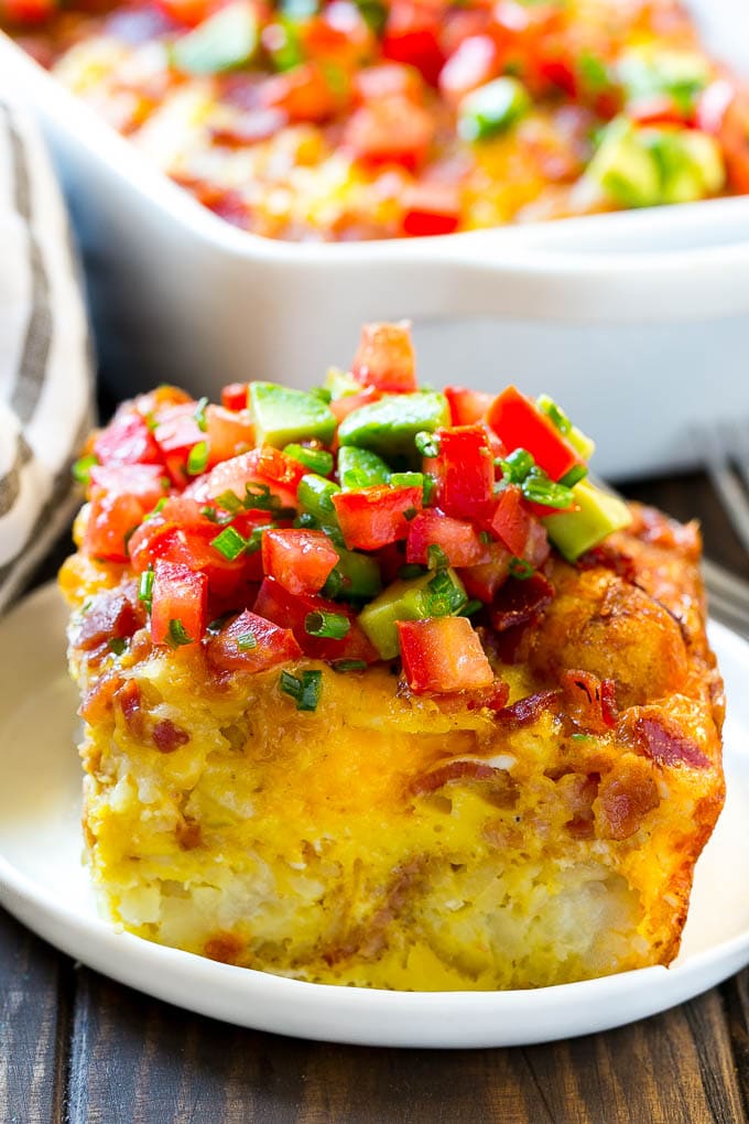 Breakfast Casserole with Bacon Recipe | Bacon and Egg Casserole | Egg Casserole with Bacon | Bacon Breakfast Casserole #eggs #bacon #casserole #breakfast #brunch #bajap A slice of egg casserole with potato tots in it.