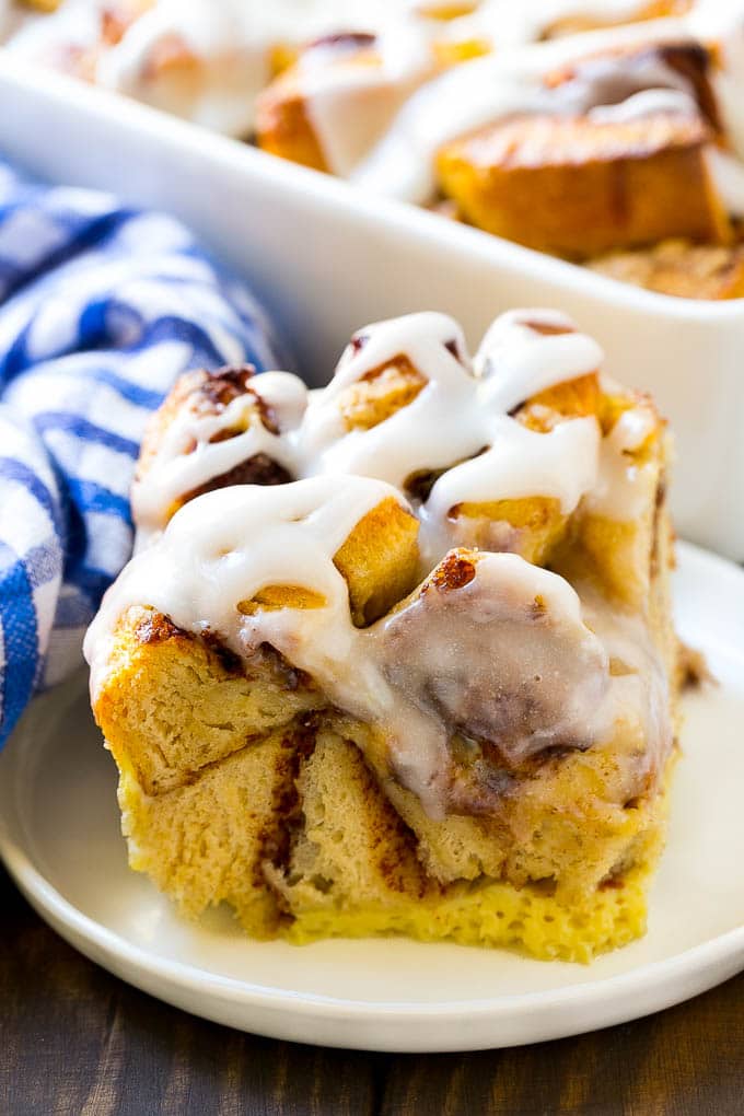 Cinnamon Roll French Toast Casserole | Cinnamon Roll French Toast Bake | Cinnamon Roll French Toast | Cinnamon French Toast #casserole #frenchtoast #cinnamonrolls #breakfast #bajap A slice of baked casserole topped with frosting.