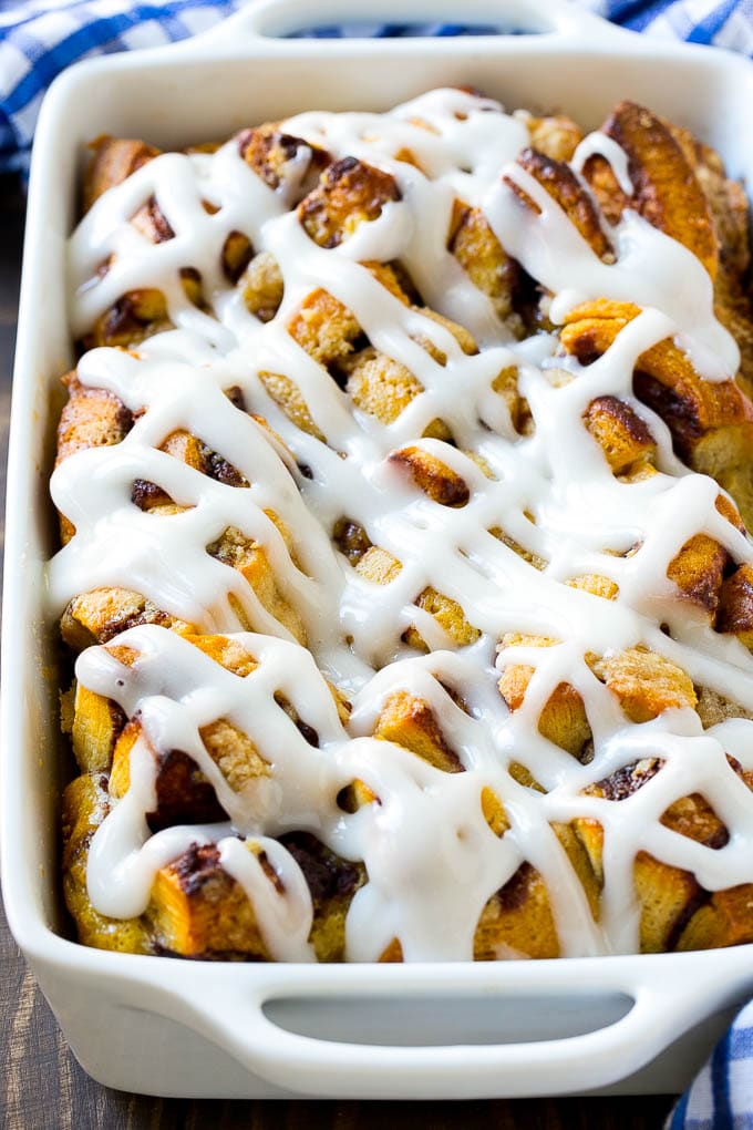Cinnamon Roll French Toast Casserole | Cinnamon Roll French Toast Bake | Cinnamon Roll French Toast | Cinnamon French Toast #casserole #frenchtoast #cinnamonrolls #breakfast #bajap A cinnamon roll french toast casserole in a baking dish, topped with icing.