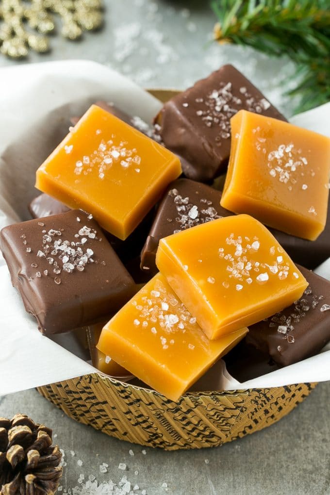 Microwave Caramels with Sea Salt Recipe | Homemade Caramels | Sea Salt Caramel | Homemade Candy #candy #caramels #caramel #microwavecaramels #homemade #dessert #bajap A basket of microwave caramels topped with sea salt.