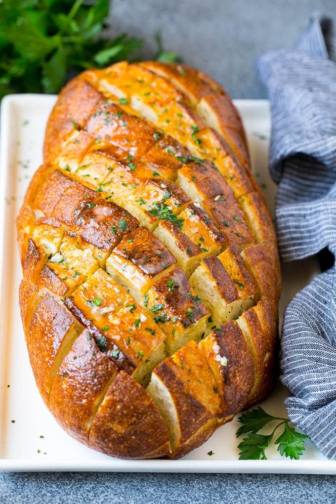 Pull Apart Bread | Garlic Bread | Cheese Bread #bread #garlic #cheese #sidedish #appetizer #bajap Baked garlic pull apart bread garnished with parsley.