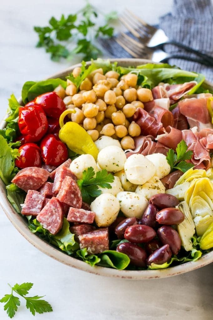 Antipasto Salad Recipe | Italian Salad | Main Course Salad | Antipasto Recipe #salad #salami #italianfood #dinner #lunch #bajap Antipasto salad with cured meats, fresh mozzarella cheese and roasted peppers over salad greens.