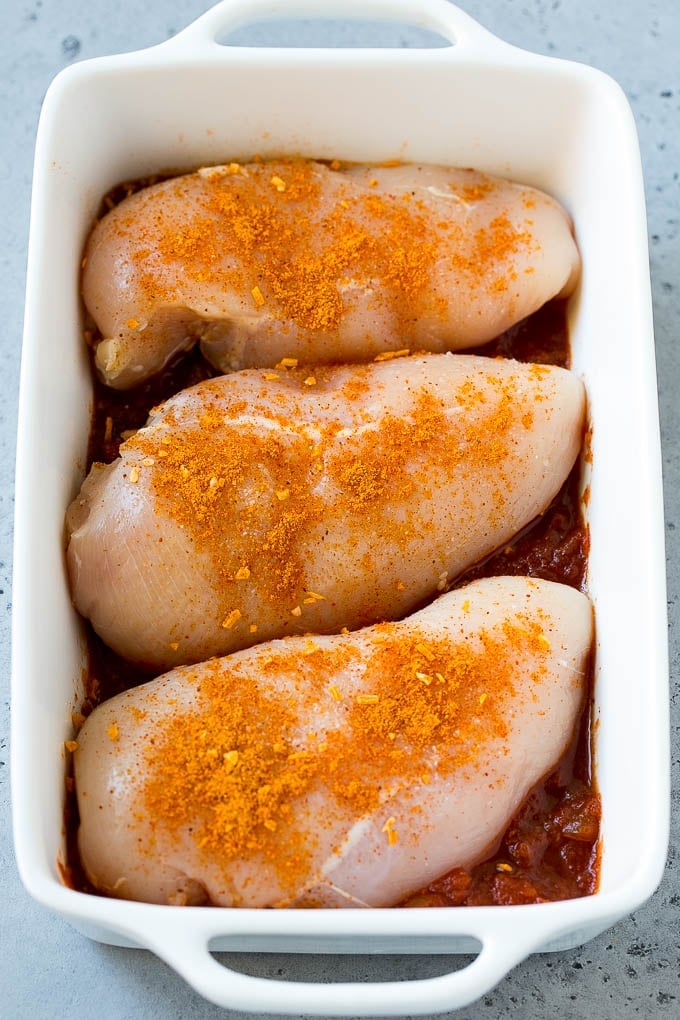 Salsa Chicken Recipe | Baked Chicken | Mexican Chicken #chicken #salsa #mexican #lowcarb #keto #glutenfree #dinner #bajap Poultry in a baking dish topped with taco seasoning.