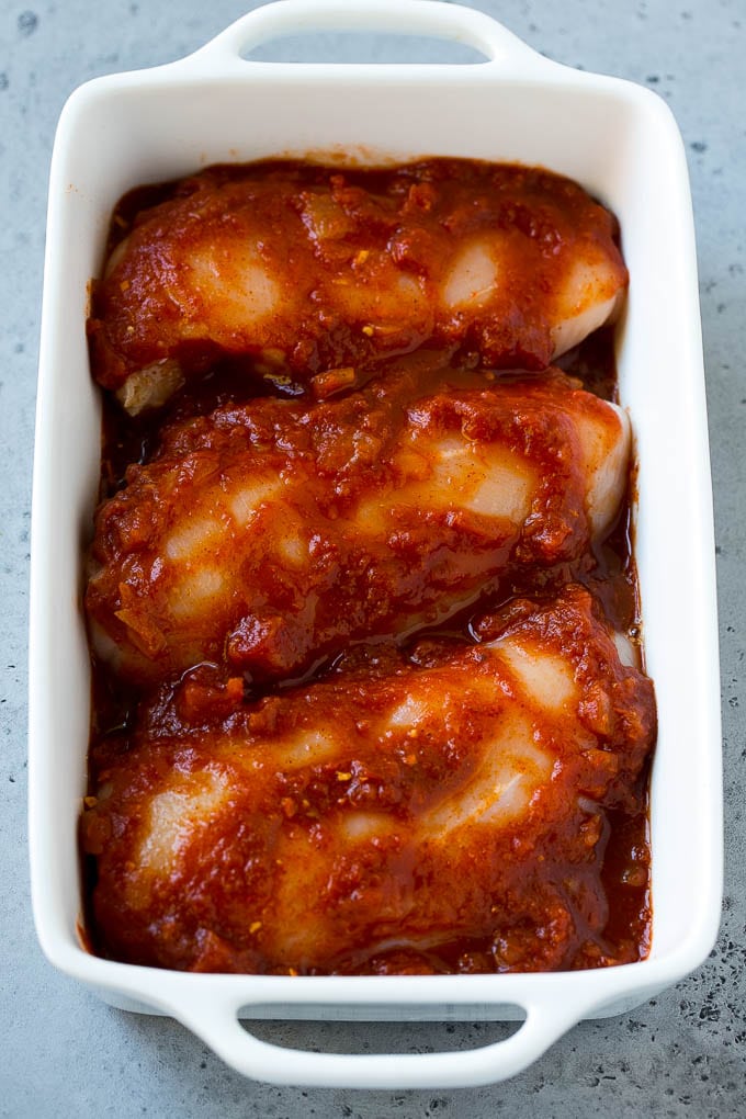 Salsa Chicken Recipe | Baked Chicken | Mexican Chicken #chicken #salsa #mexican #lowcarb #keto #glutenfree #dinner #bajap Chicken breasts in a baking dish coated with salsa.