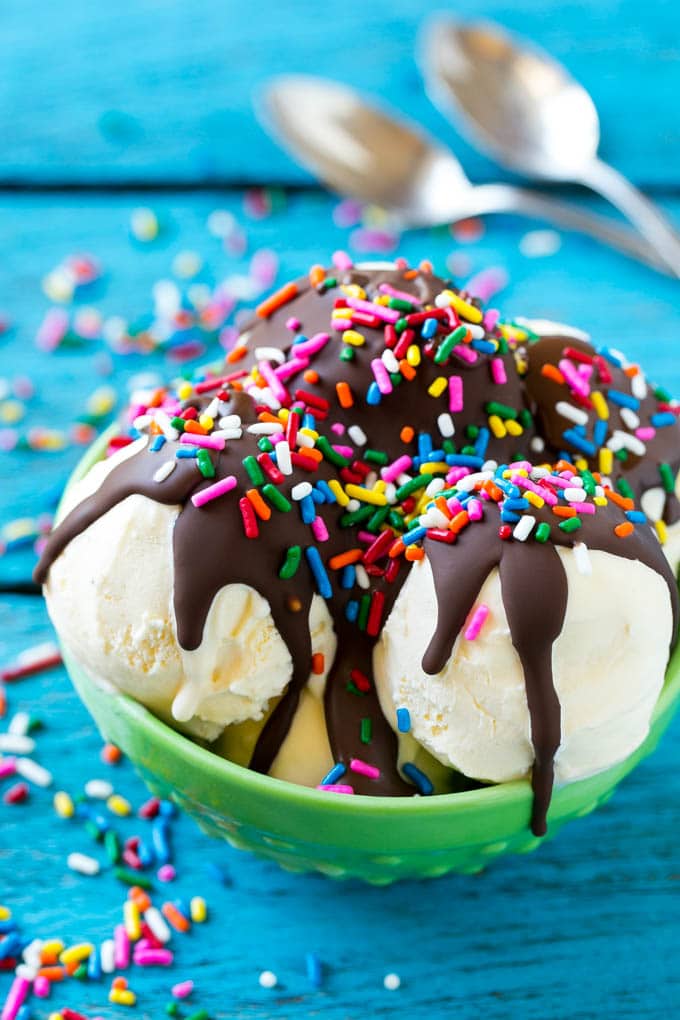 Homemade Magic Shell Recipe | Chocolate Ice Cream Topping | Chocolate Sauce | Hard Chocolate Coating #chocolate #icecream #dessert #bajap Magic shell over scoops of ice cream, topped with rainbow sprinkles.