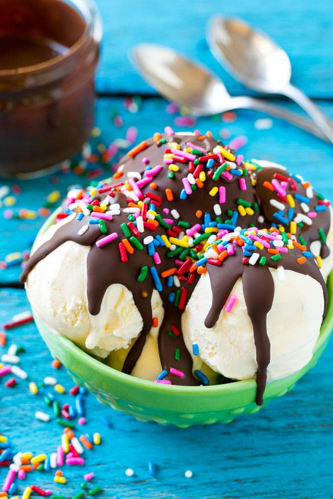 Homemade Magic Shell Recipe | Chocolate Ice Cream Topping | Chocolate Sauce | Hard Chocolate Coating #chocolate #icecream #dessert #bajap Magic shell over vanilla ice cream with rainbow sprinkles.