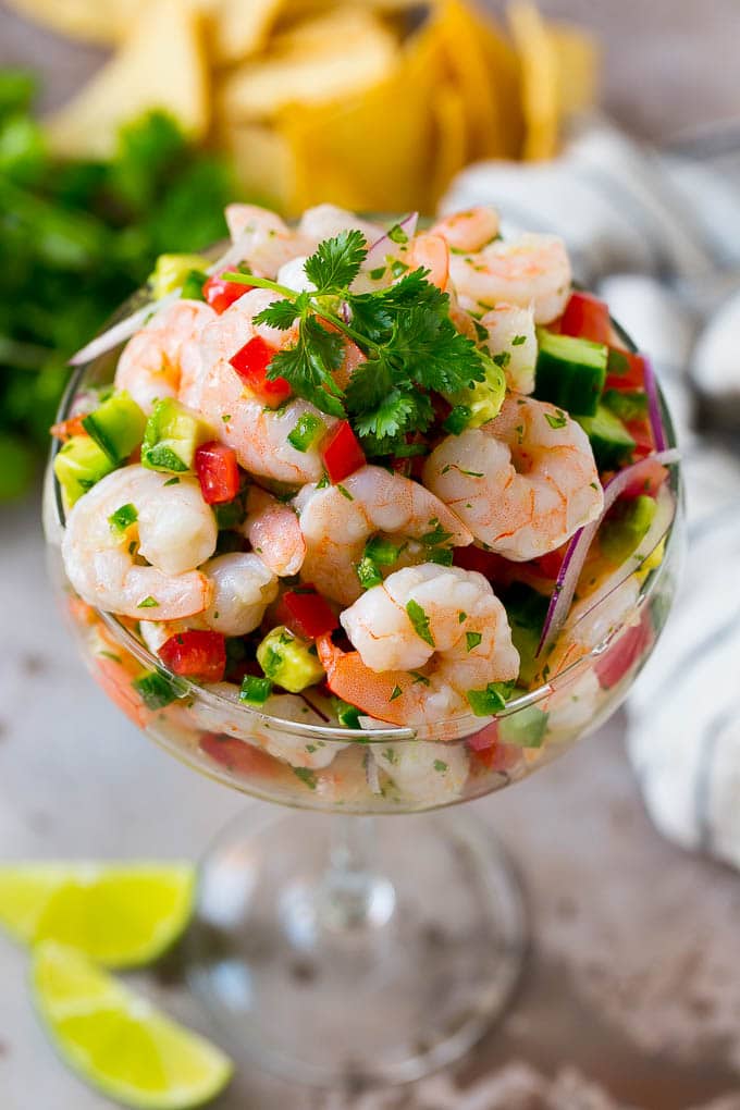 Shrimp Ceviche Recipe | Mexican Shrimp | Marinated Shrimp #shrimp #ceviche #cleaneating #healthy #lowcarb #keto #glutenfree #dinner #appetizer #bajap Shrimp ceviche in a serving cup garnished with cilantro.
