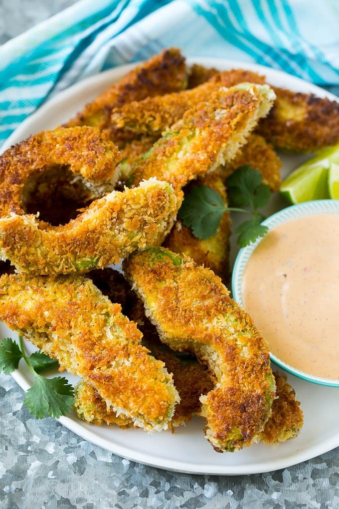 Avocado Fries Recipe | Fried Avocado | Avocado Fritters #avocado #appetizer #snack #bajap A plate of avocado fries served with dipping sauce.