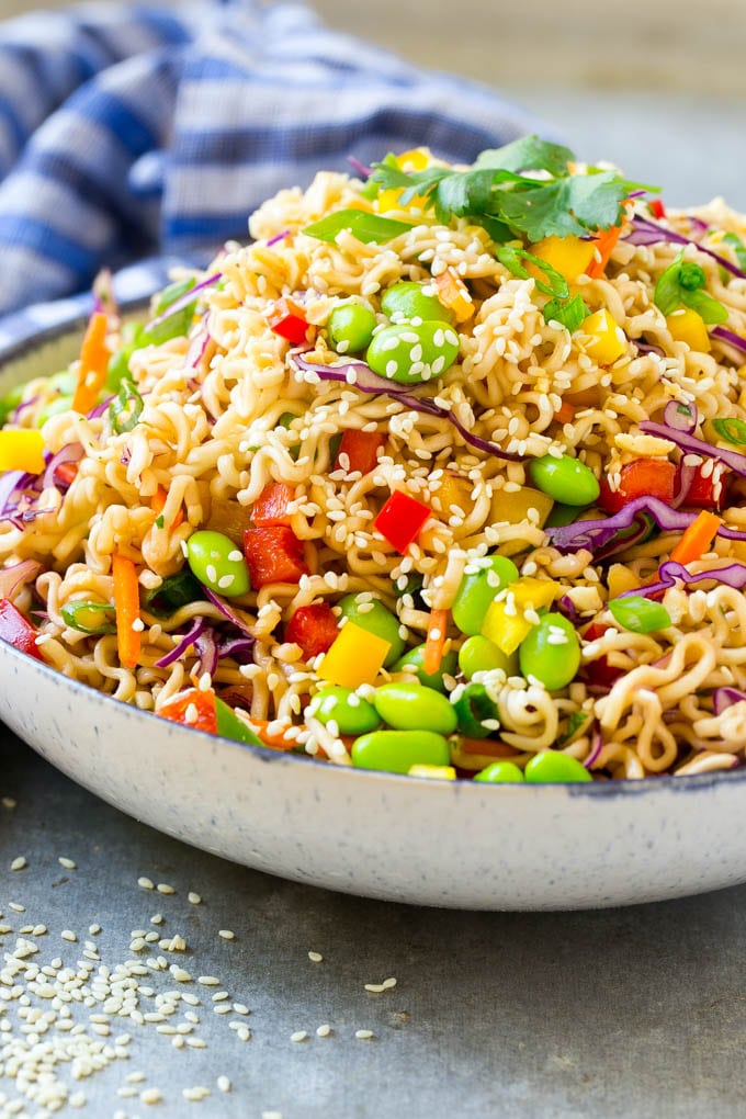 Asian Noodle Salad Recipe | Ramen Noodle Salad | Asian Salad #salad #noodles #edamame #vegetarian #bajap #lunch A mixture of ramen noodles, carrots, edamame, cabbage and peppers in a serving bowl.