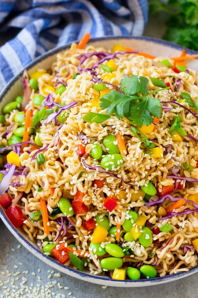 Asian Noodle Salad Recipe | Ramen Noodle Salad | Asian Salad #salad #noodles #edamame #vegetarian #bajap #lunch A bowl of Asian noodle salad with colorful vegetables.