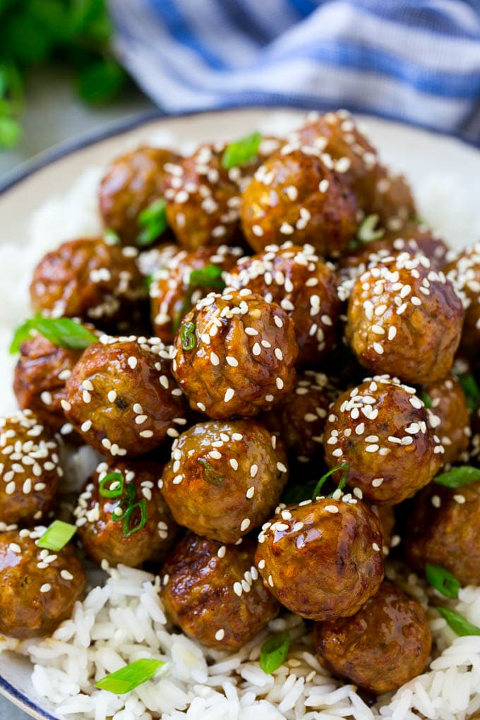 Teriyaki Meatballs Recipe | Asian Meatballs Recipe | Easy Meatball Recipe | Appetizer Meatballs #meatballs #teriyaki #beef #rice #dinner #bajap Meatballs topped with homemade sauce and sesame seeds.