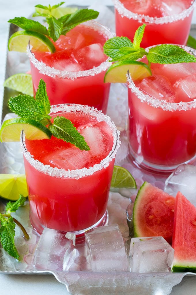 Watermelon Agua Fresca | Watermelon Drink | Agua Fresca Recipe #watermelon #aguafresca #watermelondrink #drink #bajap #summer Watermelon agua fresca in sugar rimmed glasses with lime and mint for garnish.