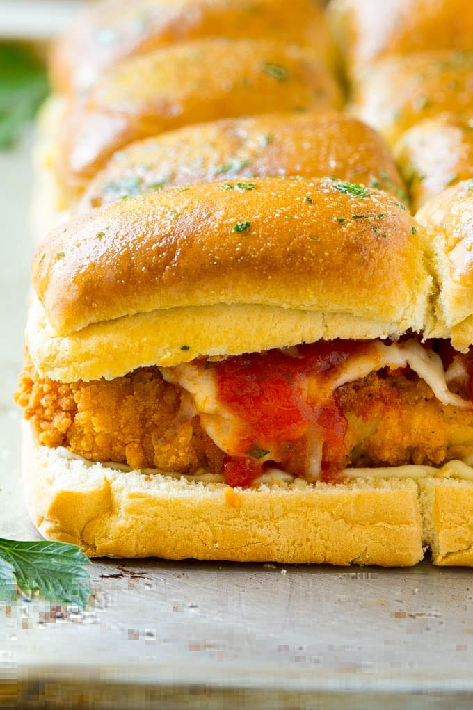 Chicken Parmesan Sliders | Chicken Parmesan Sandwich Recipe | Slider Sandwich Recipe #sliders #chickenparm #chickenparmesan #chickenparmesansliders #dinner #appetizer #bajap Crispy chicken with tomato sauce and cheese on slider buns.