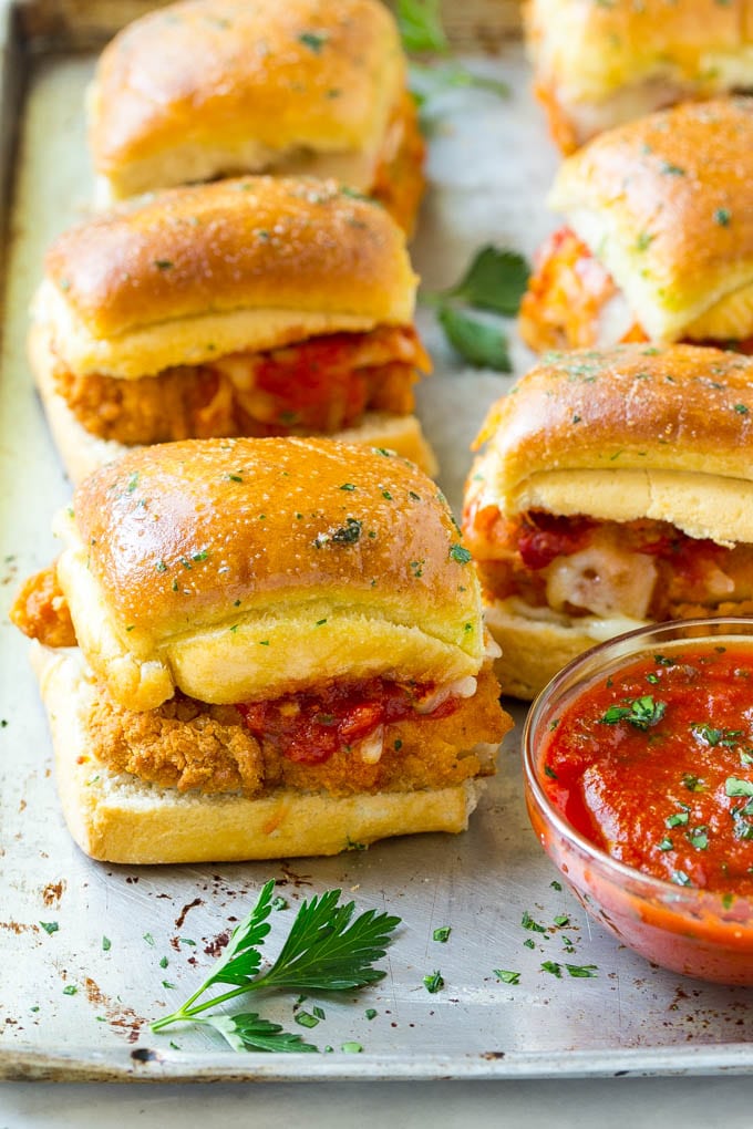 Chicken Parmesan Sliders | Chicken Parmesan Sandwich Recipe | Slider Sandwich Recipe #sliders #chickenparm #chickenparmesan #chickenparmesansliders #dinner #appetizer #bajap Chicken parmesan sliders made with crispy chicken, marinara sauce and cheese on buns.