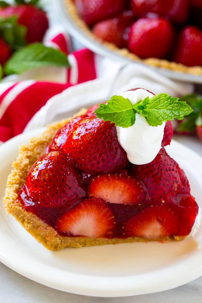 No Bake Strawberry Pie Recipe | Fresh Strawberry Pie | Strawberry Pie Recipe | No Bake Pie Recipe #strawberry #strawberrypie #nobake #nobakepie #dessert #bajap A slice of no bake fresh strawberry pie with whipped cream on top.