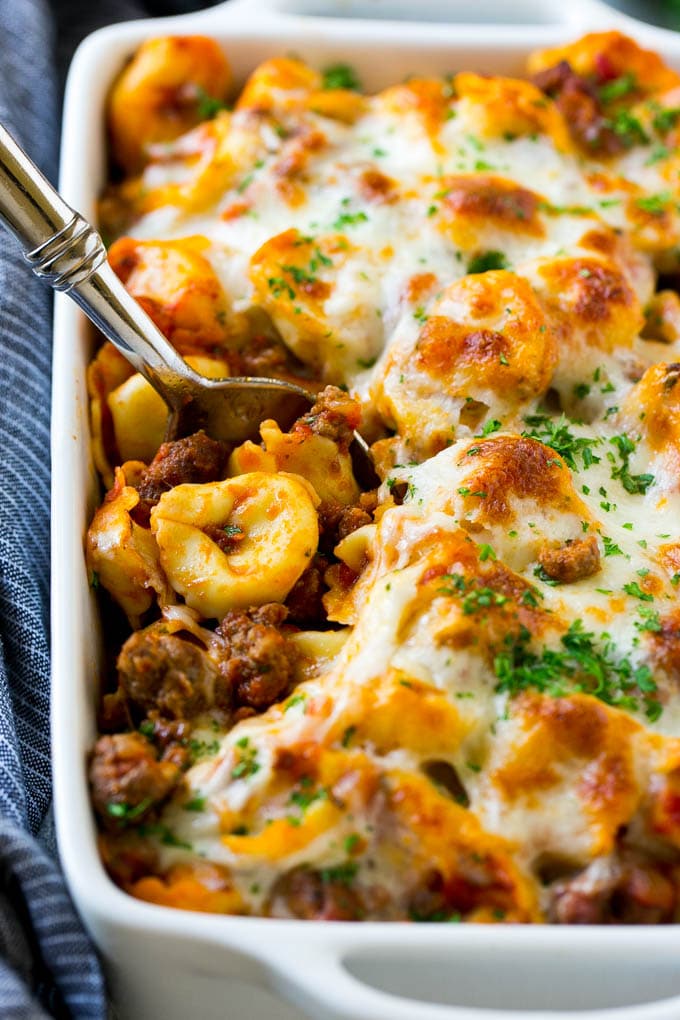 Baked Tortellini with Meat Sauce Recipe | Cheese Tortellini | Tortellini Recipe | Baked Pasta Recipe #tortellini #bakedtortellini #meatsauce #pasta #dinner #bajap A pan of baked tortellini in a meat sauce, all covered with cheese.