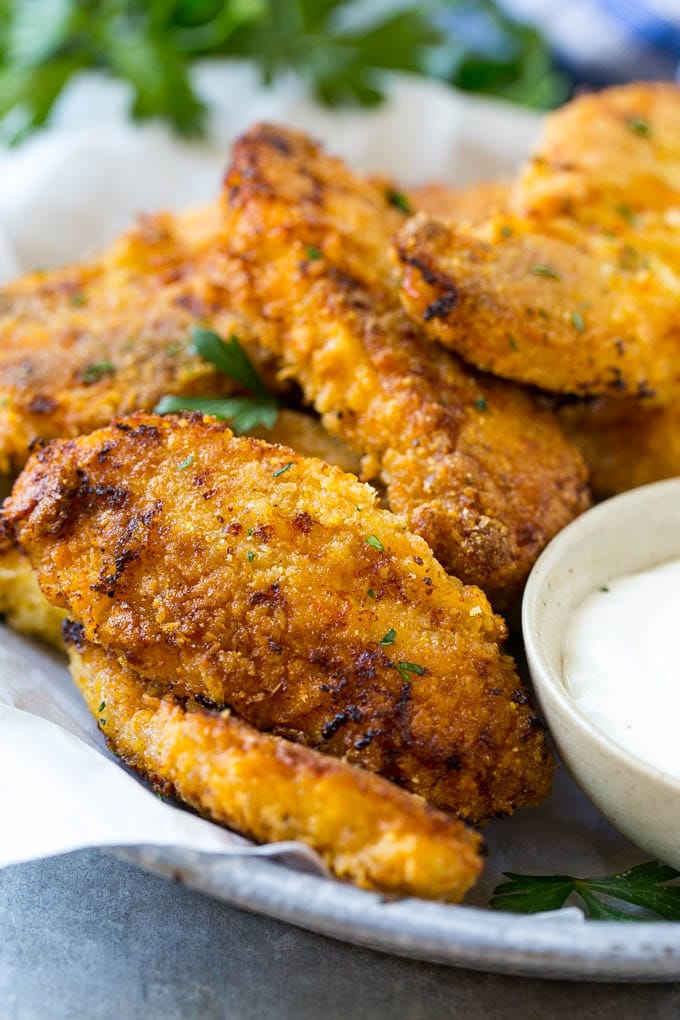 Baked Fried Chicken Recipe | Oven Fried Chicken | Baked Chicken Fingers | Crispy Chicken Fingers #chicken #friedchicken #bakedchicken #ovenfriedchicken #chickenfingers #dinner #bajap Baked oven fried chicken fingers in a dish with a side of ranch dressing.