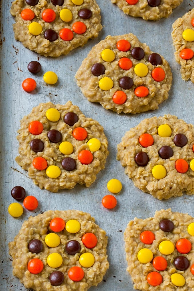 No Bake Peanut Butter Cookies Recipe | No Bake Cookies | Peanut Butter Cookies #peanutbutter #cookies #nobake #nobakecookies #peanutbuttercookies #dessert #bajap A sheet pan full of cookies with candies on top.